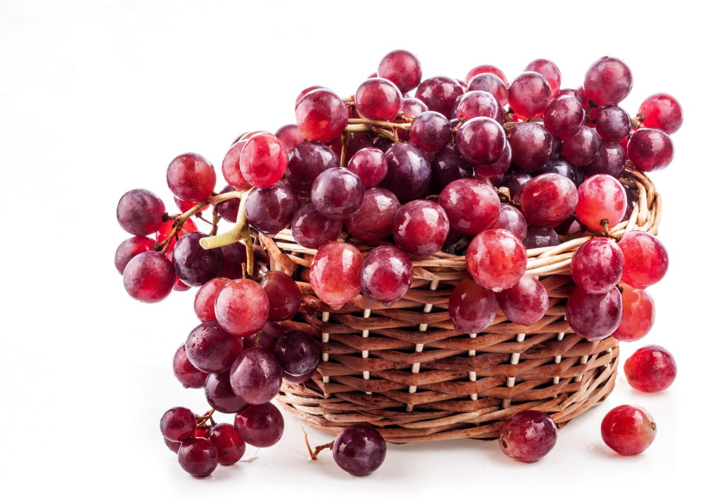 Collection of red grapes, bottle and cork Isolated on white
